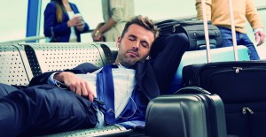 man-sleeping-at-airport